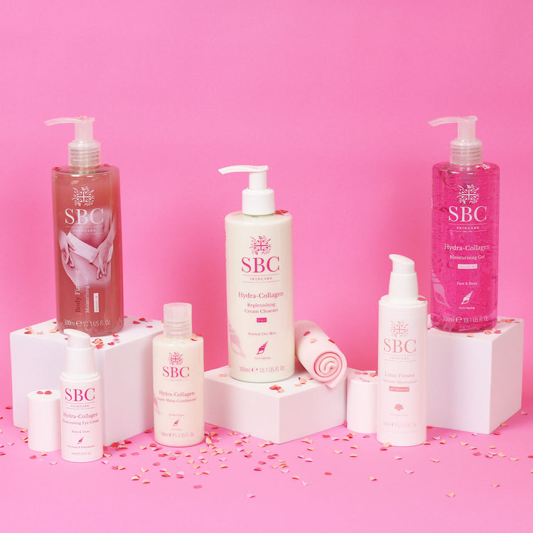 Award Winning SBC Skincare Products on a pink background with confetti 