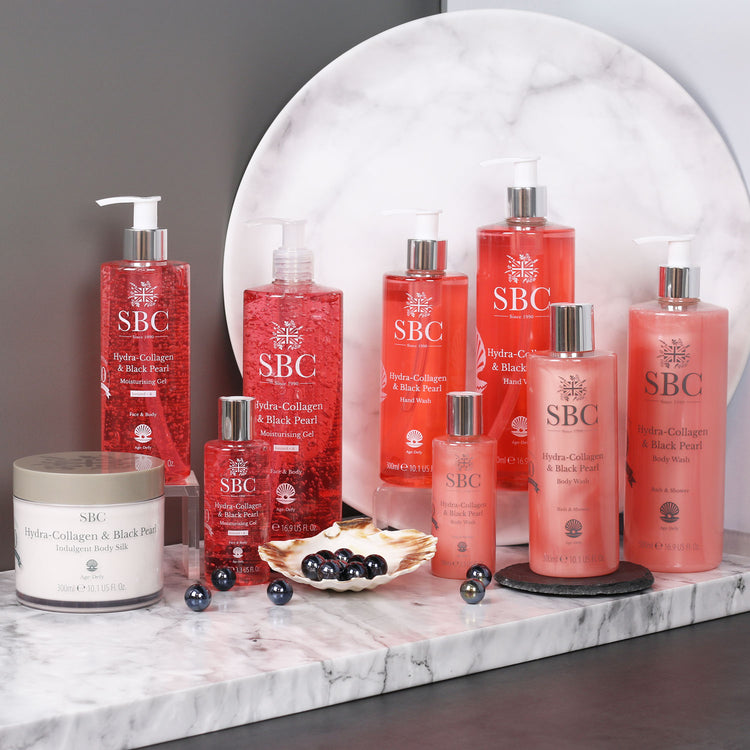Lots of Hydra-Collagen & Black Pearl products with black pearls and marble accessories 