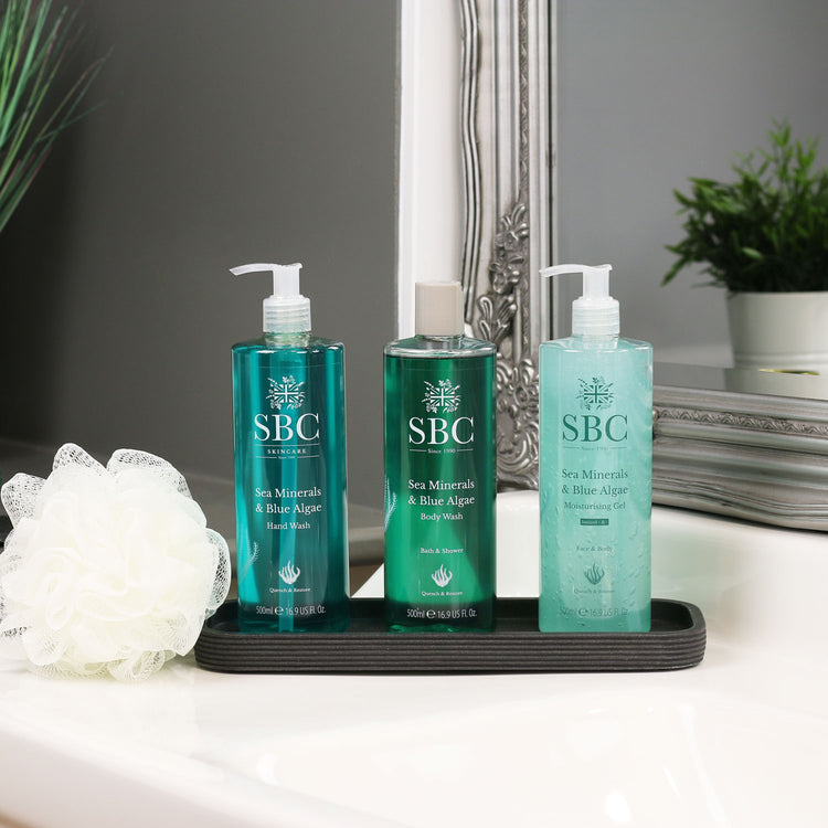 Sea Minerals & Blue Algae Hand Wash, Body Wash and Moisturising Gel on a bathroom sink in a slate dish 