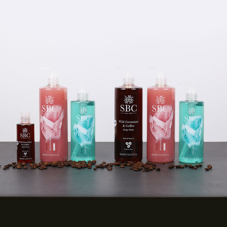 Body Sculpt Products lined up on a black desk with coffee beans 