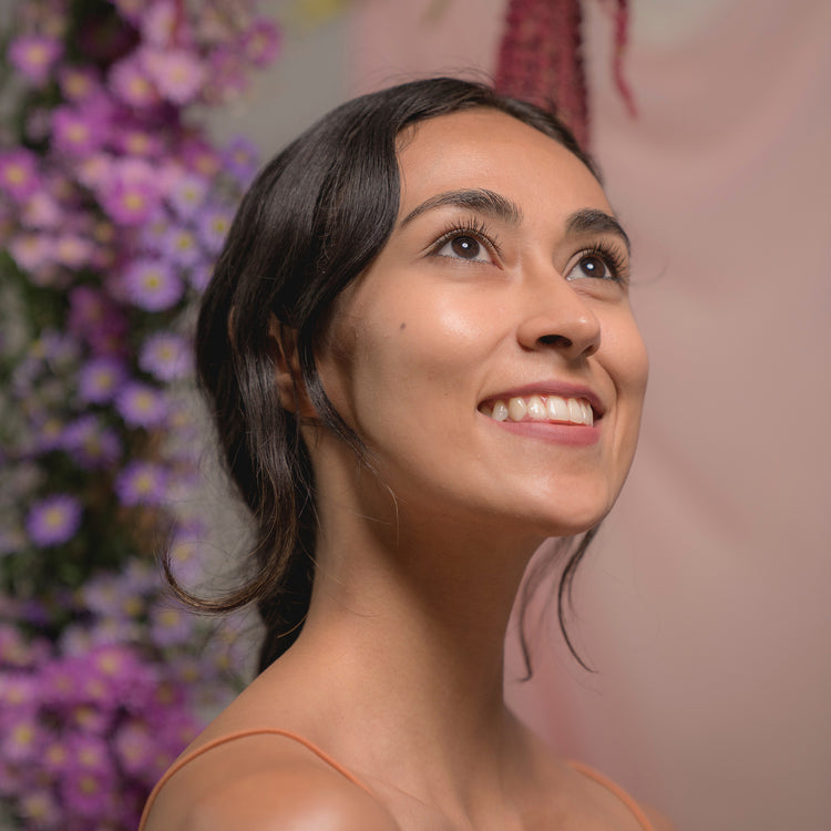Smiling woman on a floral background