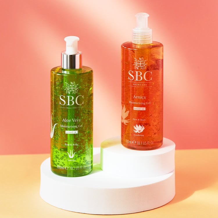 Arnica and Aloe Vera Moisturising Gels on white plinths on a coloured background
